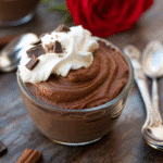 Rich vegan chocolate mousse topped with raspberries